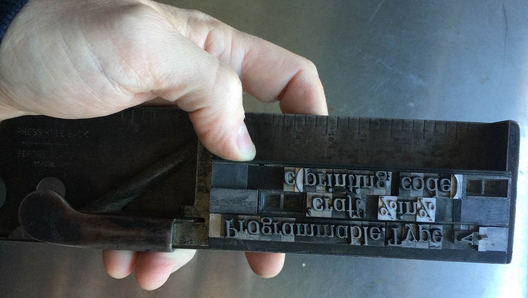 A line of R code set in moveable type.